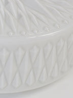Adler ceiling light shown lit with a warm glow