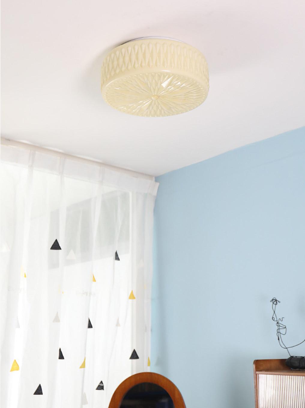 Adler ceiling light shown from below with diffused glow