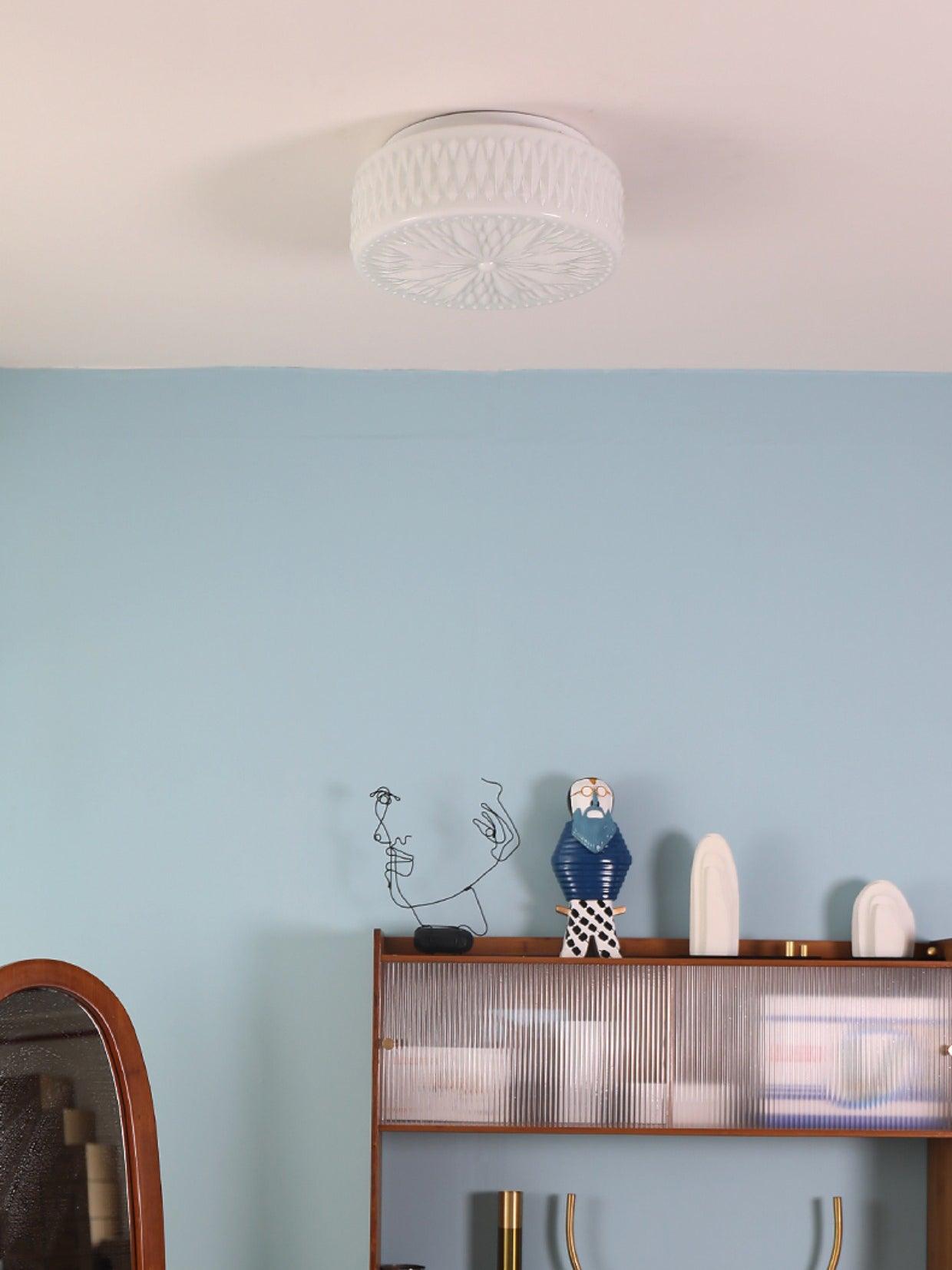 Adler ceiling light mounted in a bright modern room