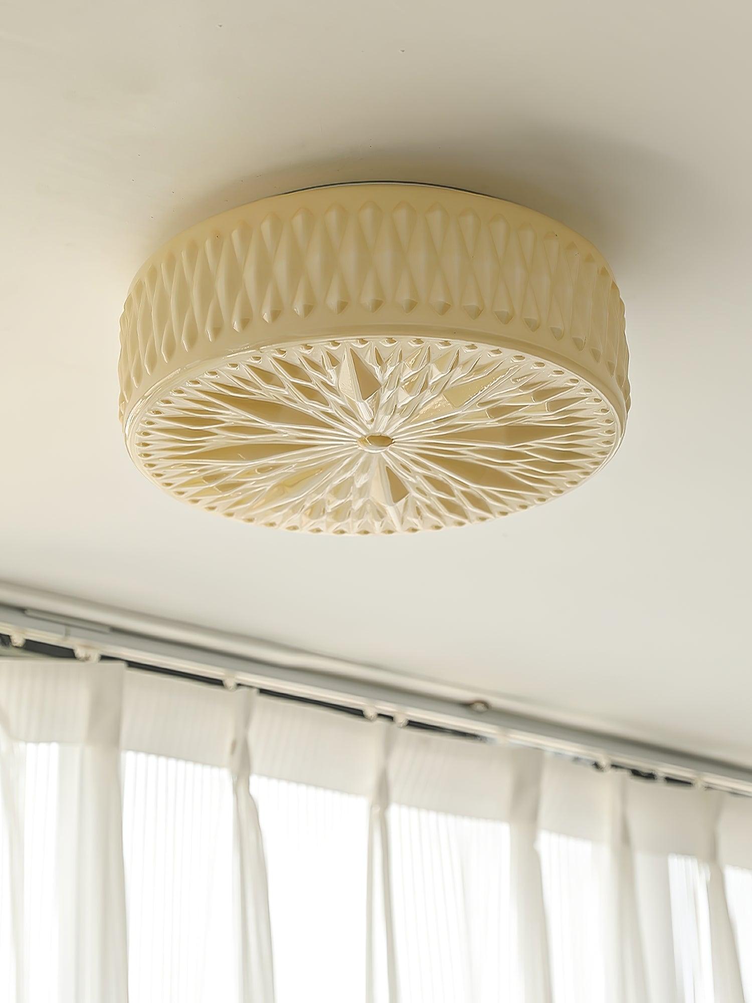 Adler ceiling light shown lit in a kitchen setting