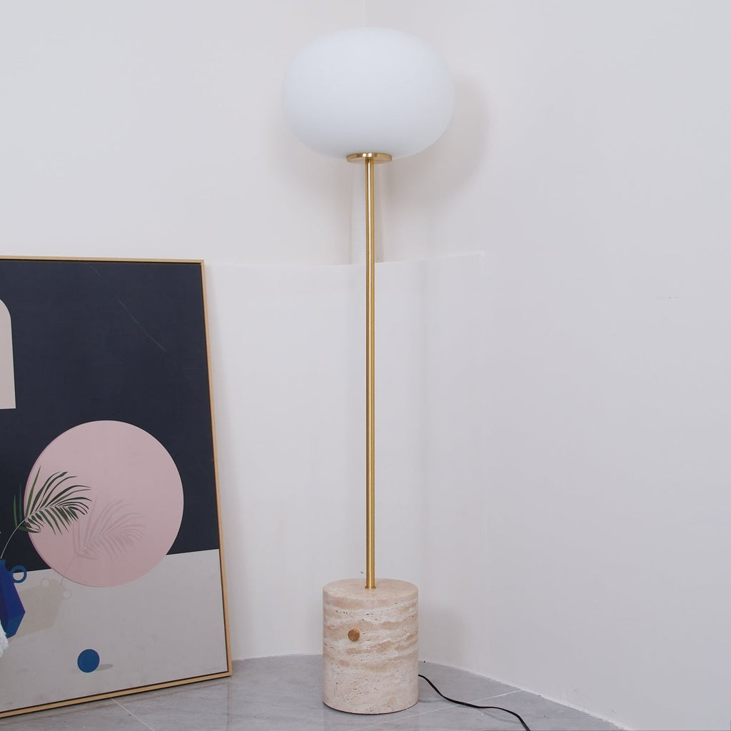 Another view of the Clérachic floor lamp in the same white corner, beside the leaning abstract artwork.