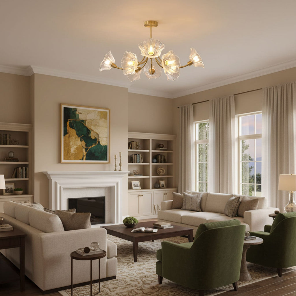 This Clérachic brass chandelier hangs above a beige living room with a stone fireplace and green armchairs.