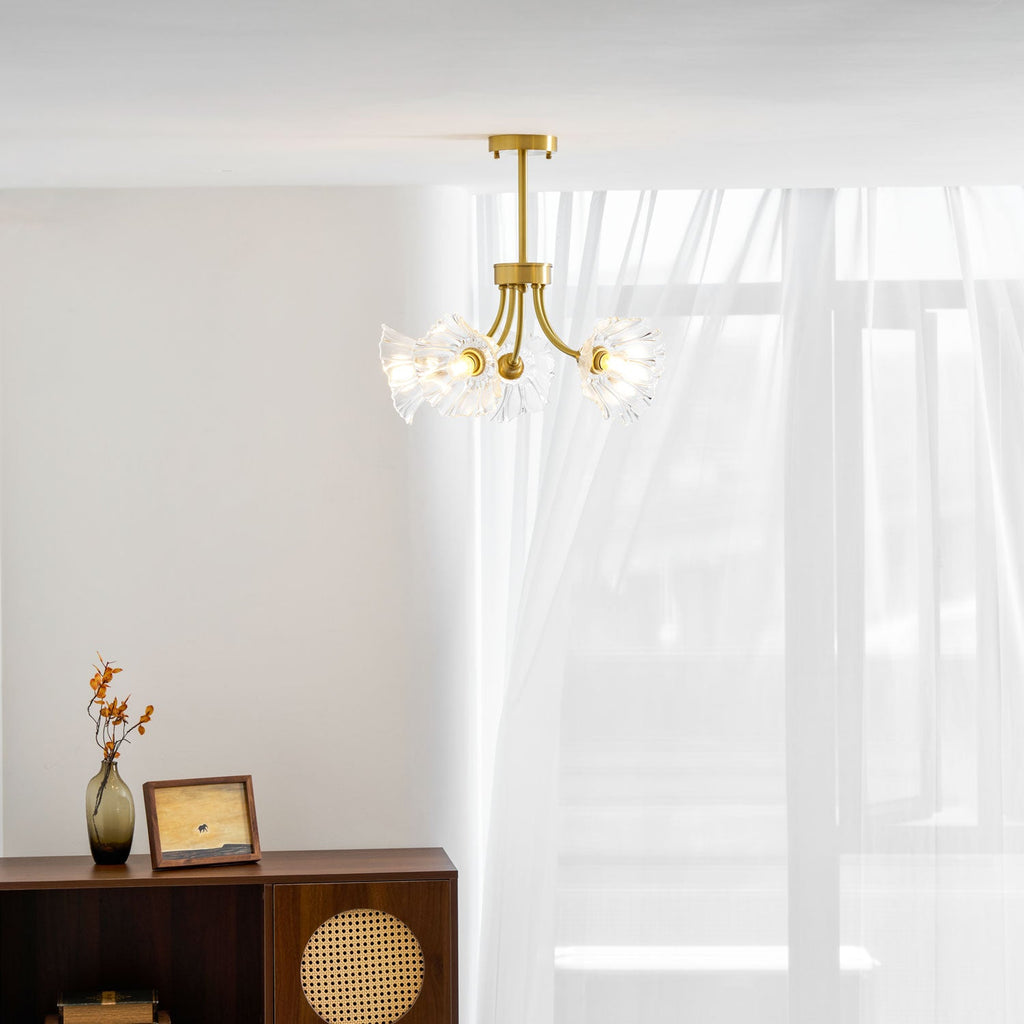 A vertical view shows this Clérachic chandelier beside a sheer curtain, with a rattan cabinet and vase below.