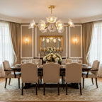 Gold curtains and wall sconces frame this Clérachic chandelier, hung above a long dining table set for a gathering.