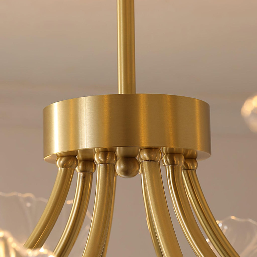 Close view of the brass canopy on this Clérachic chandelier, where its multiple arms converge at the ceiling mount.