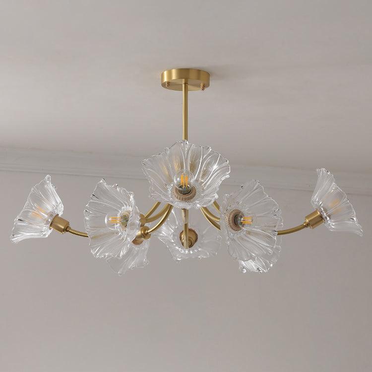Product shot on a white backdrop shows this Clérachic chandelier's brass arms holding five ruffled glass petal shades.