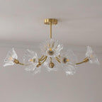Product shot on a white backdrop shows this Clérachic chandelier's brass arms holding five ruffled glass petal shades.