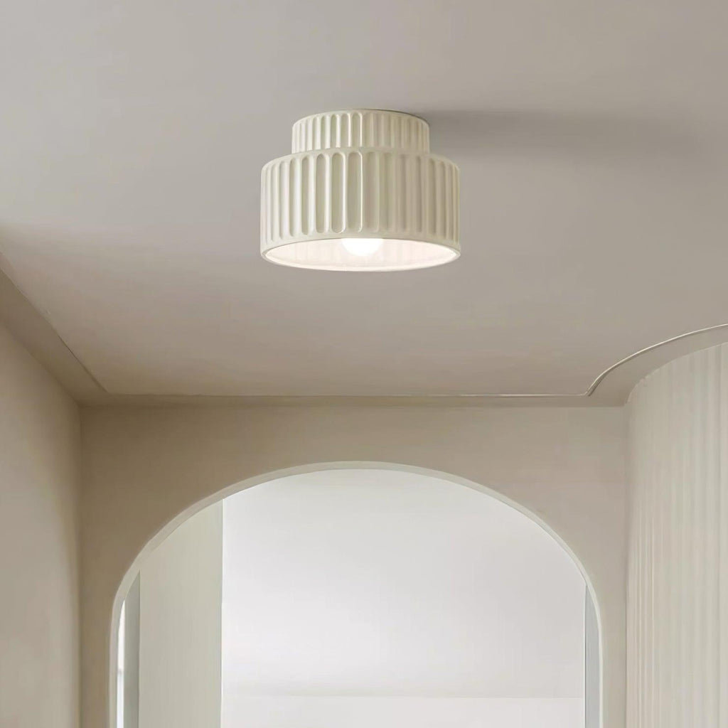 Pleated resin ceiling light in beige with soft ambient glow