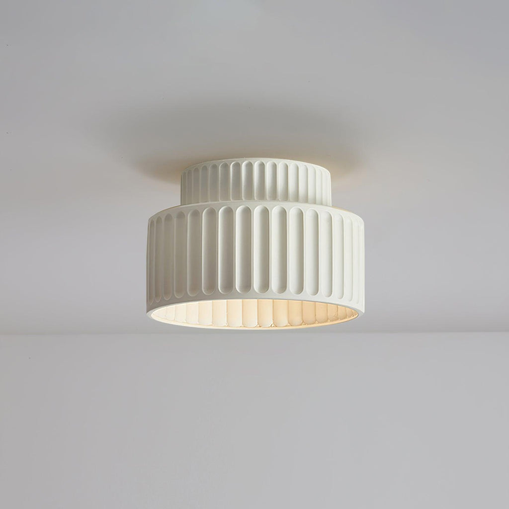 Pleated resin ceiling light with soft glow and white rim
