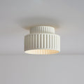 Pleated resin ceiling light with soft glow and white rim