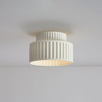 Pleated resin ceiling light with soft glow and white rim