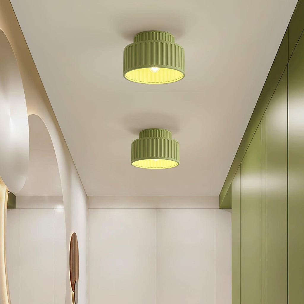 Pleated resin ceiling light in green with soft warm glow