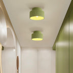 Pleated resin ceiling light in green with soft warm glow