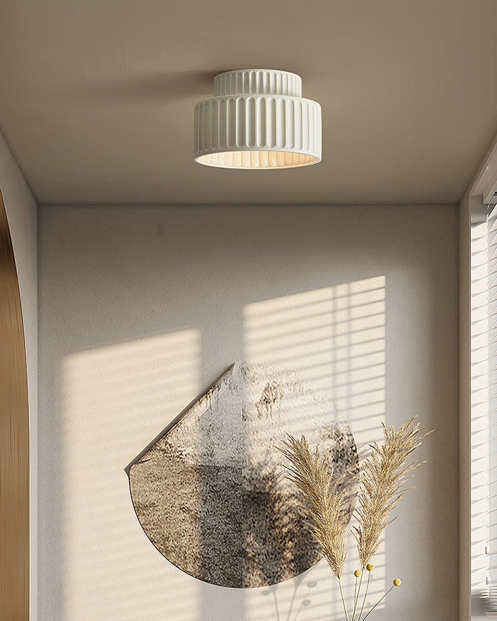 Pleated resin ceiling light with warm globe and pleated detailing