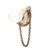 A larger crop repeats the Clérachic sconce's veined marble disc paired with an antique-brass chain and finial.
