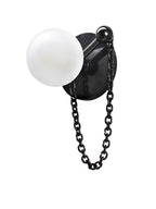 An isolated studio shot pairs the Clérachic sconce's dark stone disc with a black chain, ball finial and frosted globe.