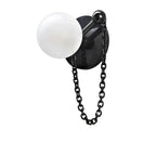 This studio swatch shows the Clérachic sconce's dark stone disc matched with a black chain and ball finial.