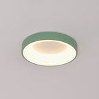 Slim white flush mount ceiling light glowing evenly overhead