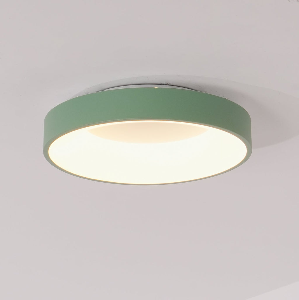 Flush mount ceiling light with white acrylic diffuser glowing