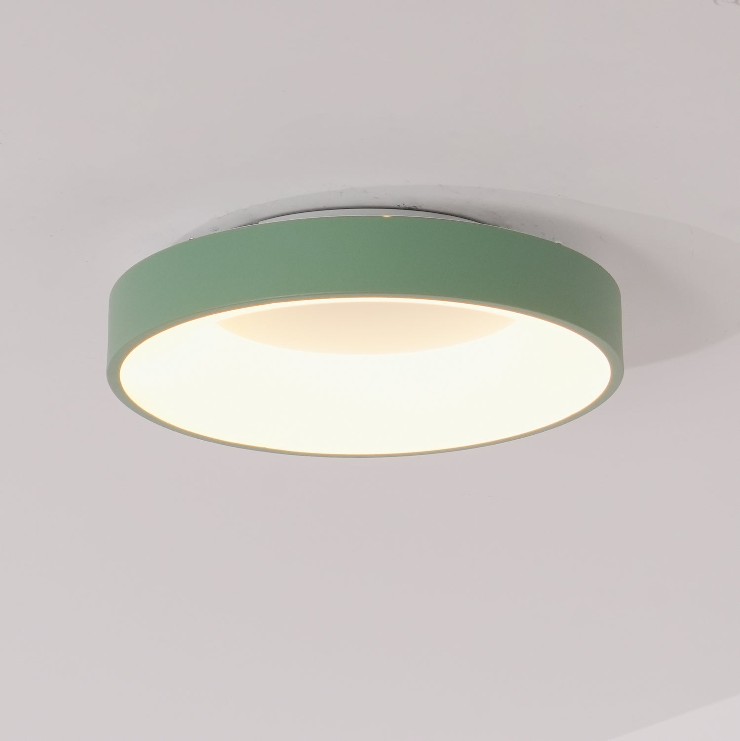 Flush mount ceiling light with white acrylic diffuser glowing