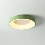 Round flush mount ceiling light shown lit and shadow-free