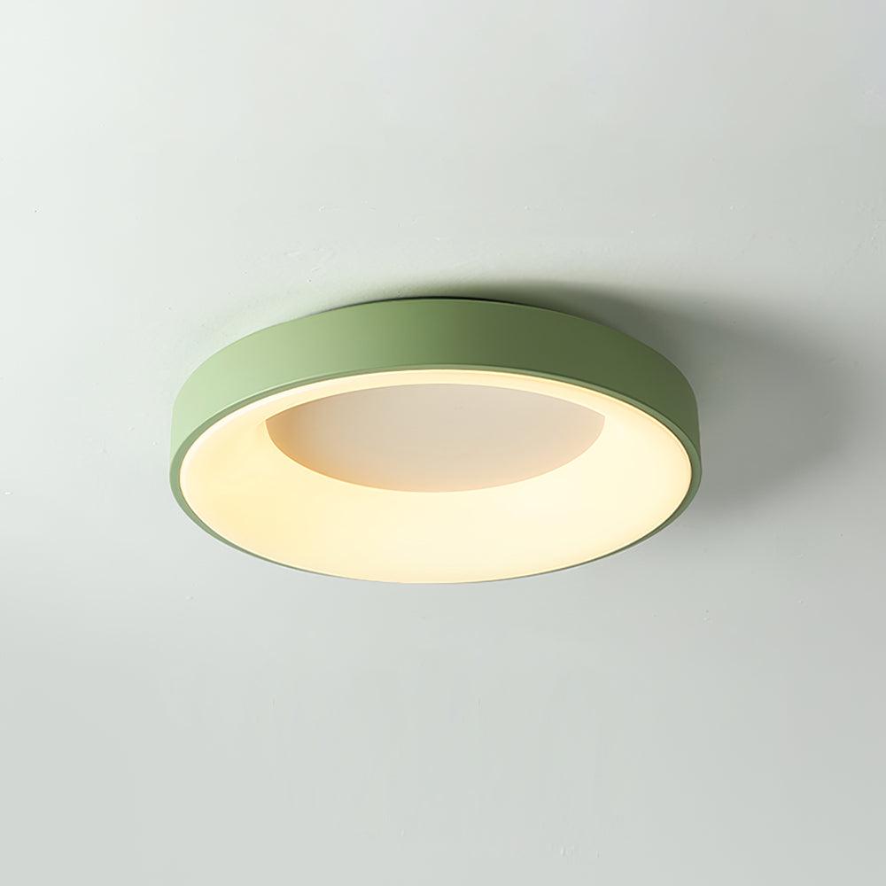 Round flush mount ceiling light shown lit and shadow-free