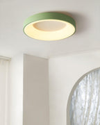 White flush mount ceiling light lit evenly across the diffuser
