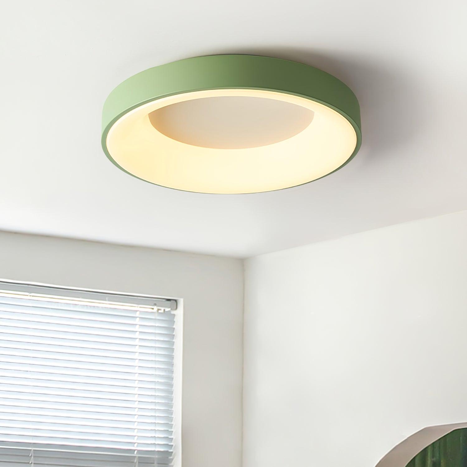 White flush mount ceiling light shown flat against the ceiling