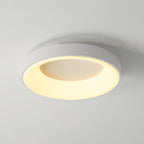 White round flush mount ceiling light shown lit and even