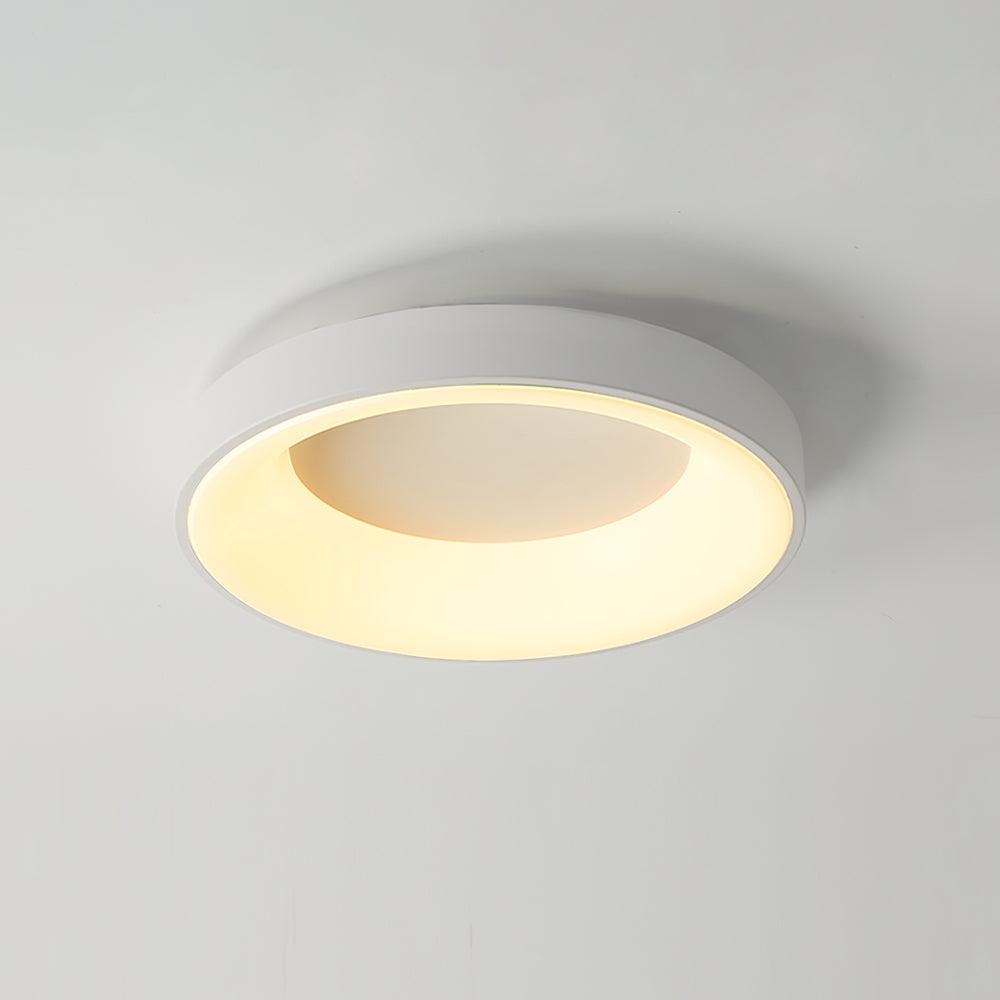 Green ceiling light hugging the ceiling with a warm glow