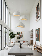 Selene Halia pendant light white shade lit softly overhead