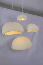 Wabi-sabi organic chandelier shown as a single organic pendant