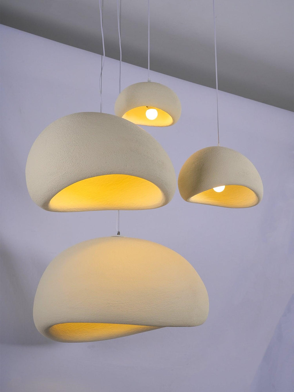Wabi-sabi organic chandelier pendant shown against a soft backdrop