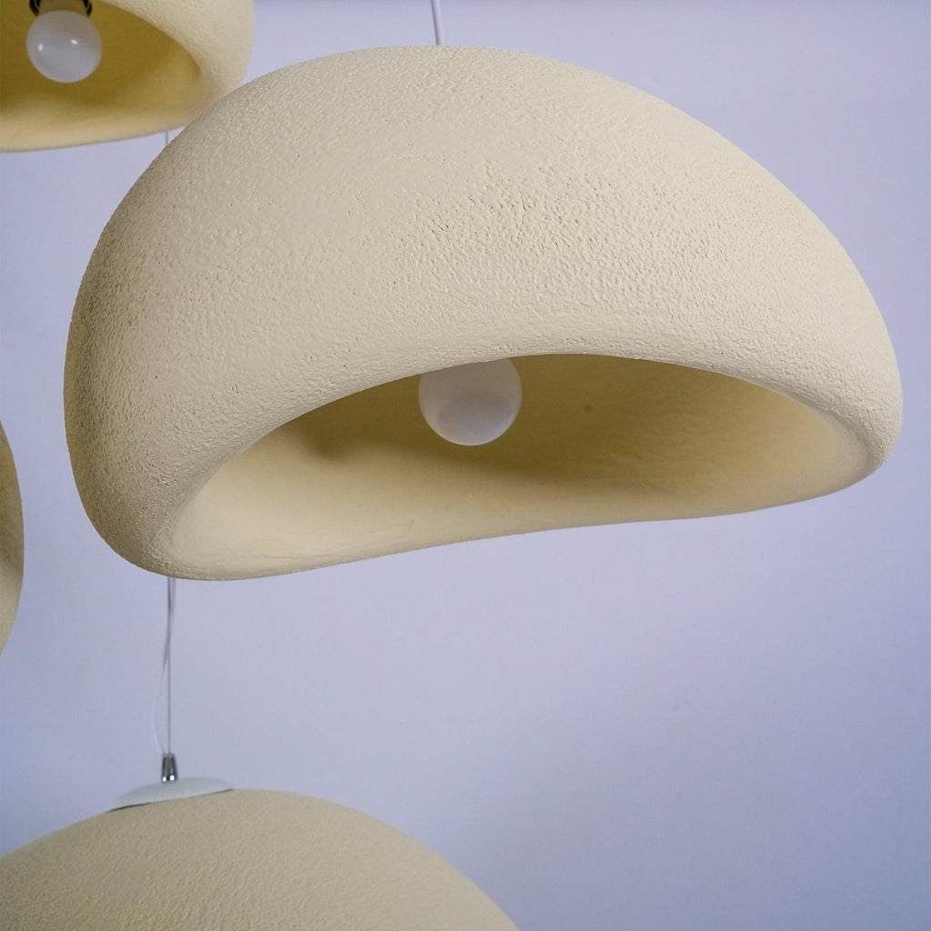 Wabi-sabi organic chandelier pendant against a soft backdrop