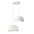 Wabi-sabi organic chandelier with sculptural HDPE forms hanging in a room