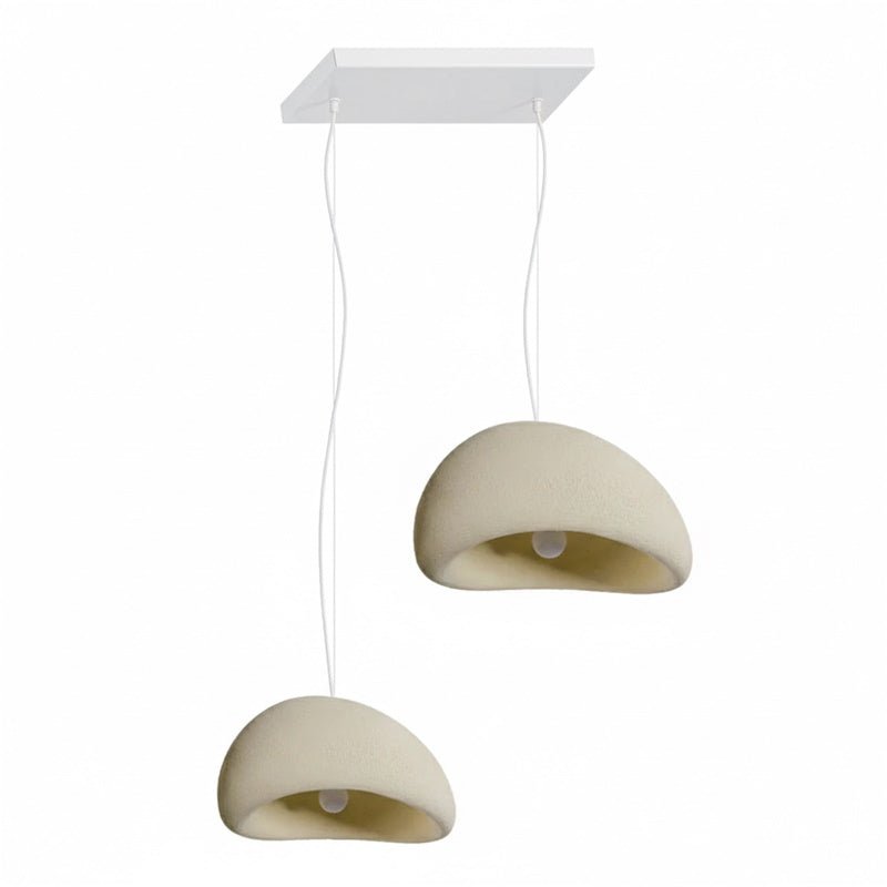 Wabi-sabi organic chandelier in a beige shade over a seating area