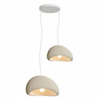 Wabi-sabi organic chandelier glowing softly over a large space