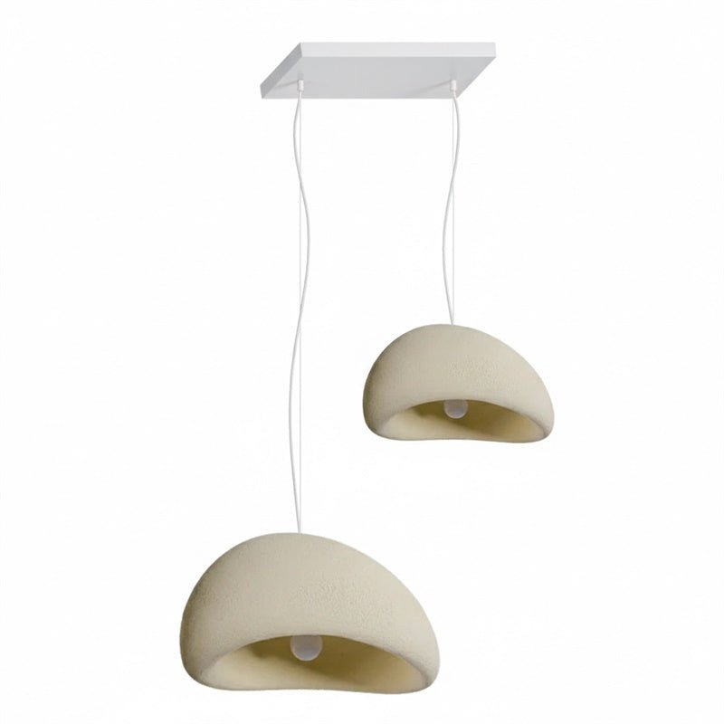 Wabi-sabi organic chandelier in a white shade in a bright room