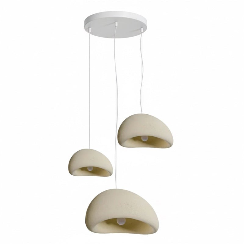 Wabi-sabi organic chandelier with soft shadows across a wall