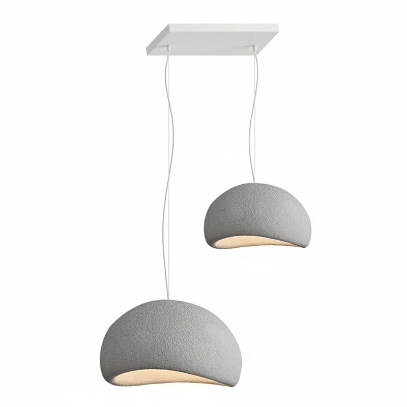 Wabi-sabi organic chandelier suspended in a high-ceiling space