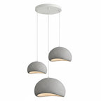Wabi-sabi organic chandelier in a linear configuration over a table