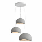 Wabi-sabi organic chandelier shown lit at dusk