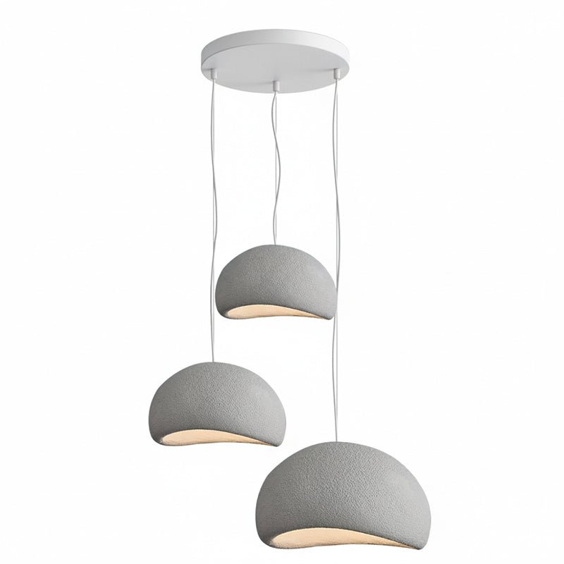 Wabi-sabi organic chandelier shown lit at dusk