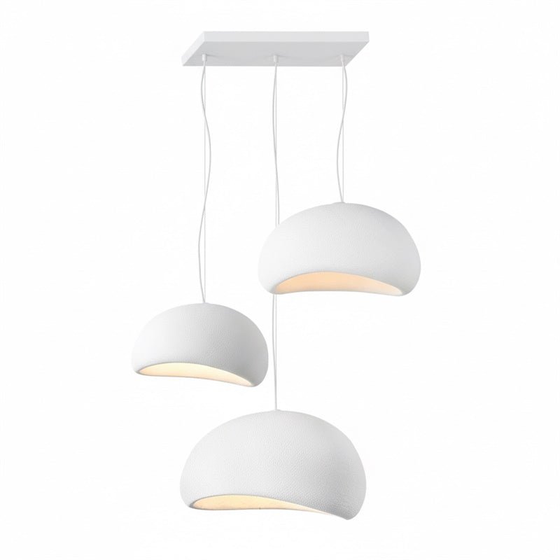 Wabi-sabi organic chandelier glowing in a meditative interior