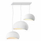 Wabi-sabi organic chandelier suspended over a lounge