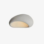 This Clérachic ceiling light glows in white texture on a plain off-white studio background.