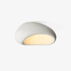 A different angle shows this Clérachic ceiling light glowing in white texture against a plain off-white background.