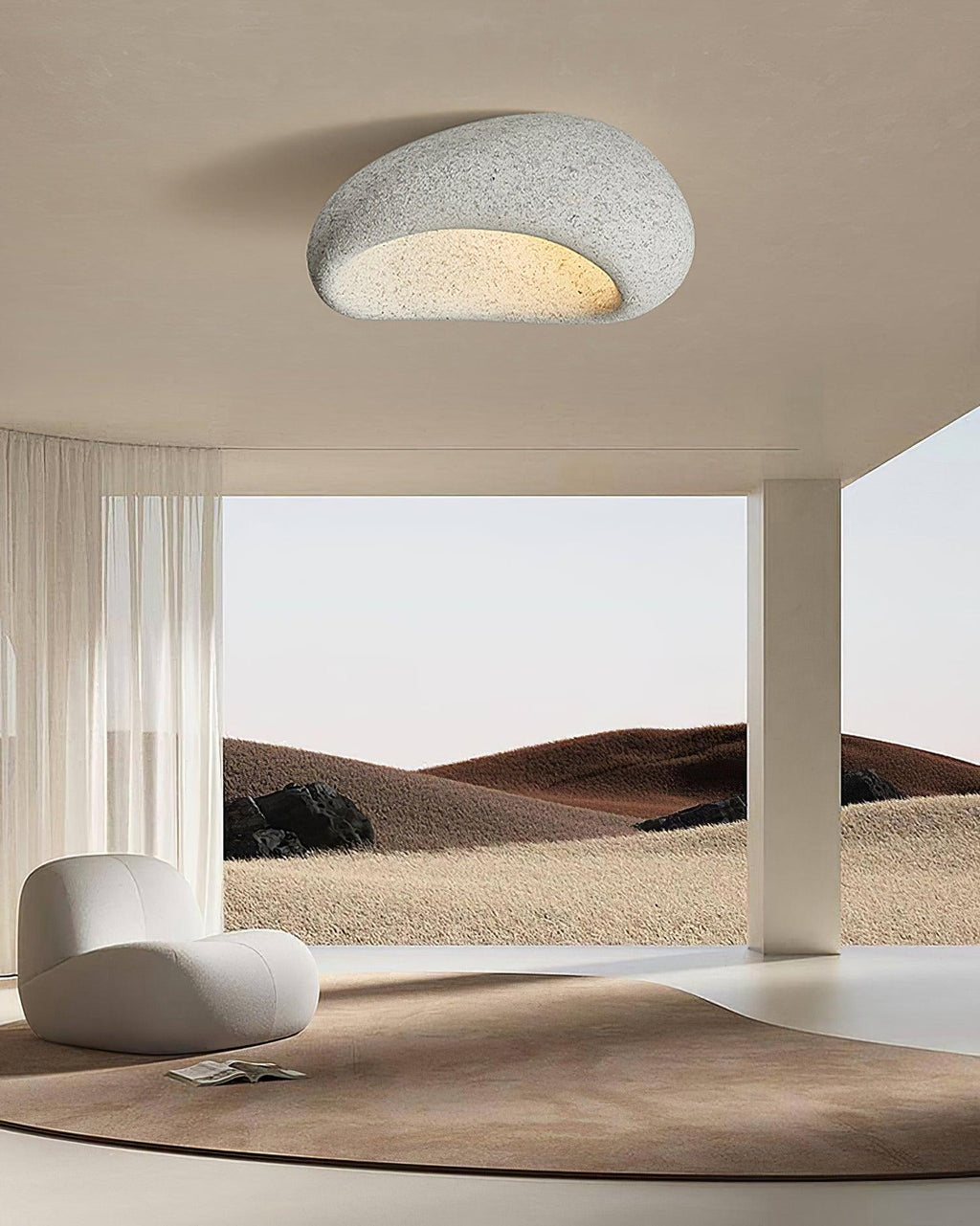 Opening onto a desert landscape view, this Clérachic ceiling light glows in a speckled grey finish.