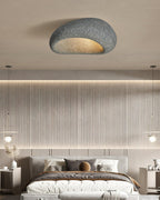 A dark speckled finish lights this Clérachic bedroom scene, with a slatted wall and pendant lamps either side.