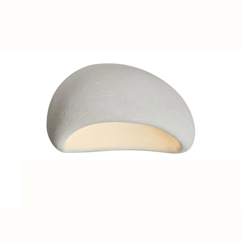 Photographed at a steep angle, this Clérachic ceiling light glows in white texture against a plain white background.